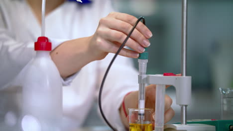 Scientist-hands-working-with-laboratory-equipment